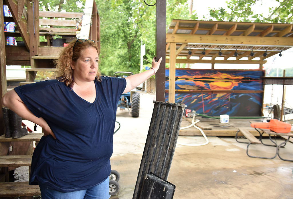 Vanessa Leitza talks with Richard King about plans for cleaning the area
